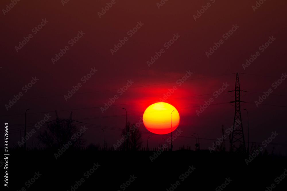 Sunset on the background of the road and antennas. Beautiful landscape. Background.