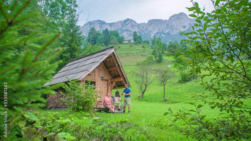 Drinking a coffee outside the mountain cabin. Beautiful nature and mountains. Topla Valley, Slovenia Drinking a coffee outside the mountain cabin. Beautiful nature and mountains. Topla Valley, Slovenia