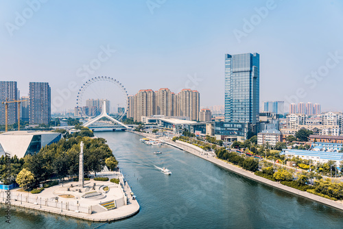Twilight scenery of Haihe River and Ferris wheel in Tianjin, China 