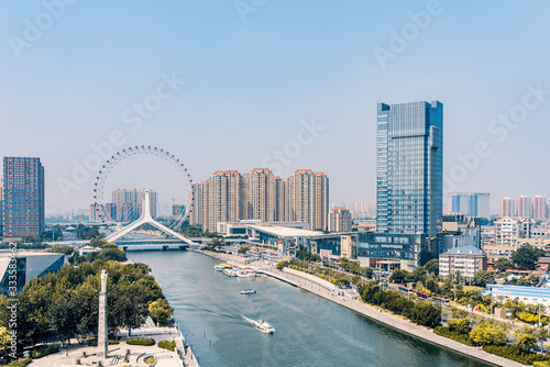 Twilight scenery of Haihe River and Ferris wheel in Tianjin, China 