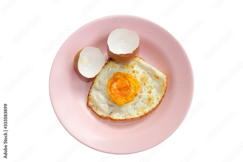 Fried egg in pink dish isolate on white background. Fried egg in pink dish isolate on white background.