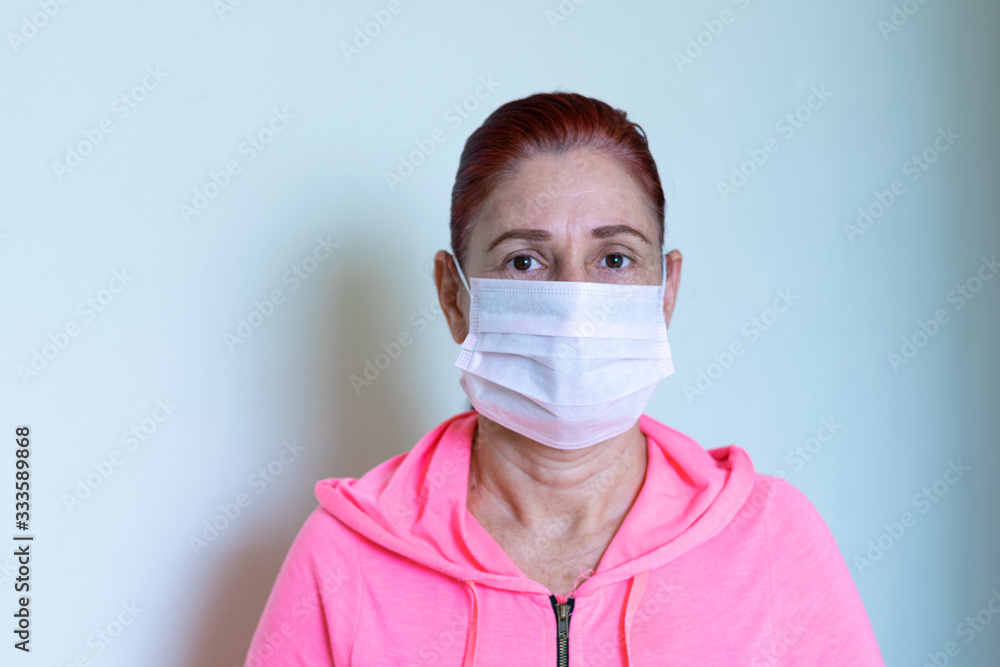 Adult woman with face mask on white background Adult woman with face mask on white background