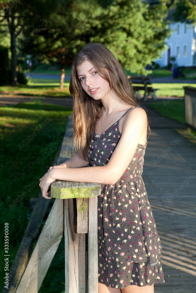 Happy young brunette woman in a park in the summer. Happy young brunette woman in a park in the summer.