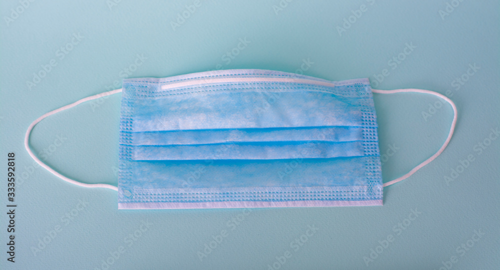 medical masks on a blue background. protection from coronavirus. personal protective equipment for breathing medical masks on a blue background. protection from coronavirus. personal protective equipment for breathing