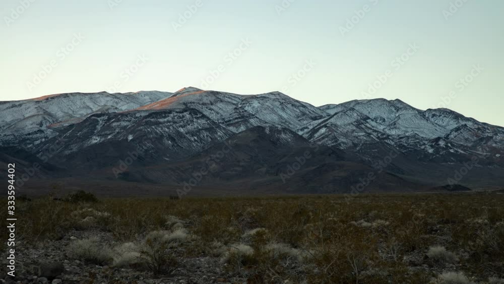 A time lapse of morning sunlight hitting Pinto Peak, a mountain in the Panamint Range in Death Valley National Park, California A time lapse of morning sunlight hitting Pinto Peak, a mountain in the Panamint Range in Death Valley National Park, California