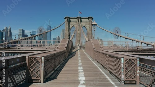 moving forward along empty pedestrian path on Brooklyn Bridge corona quarantine