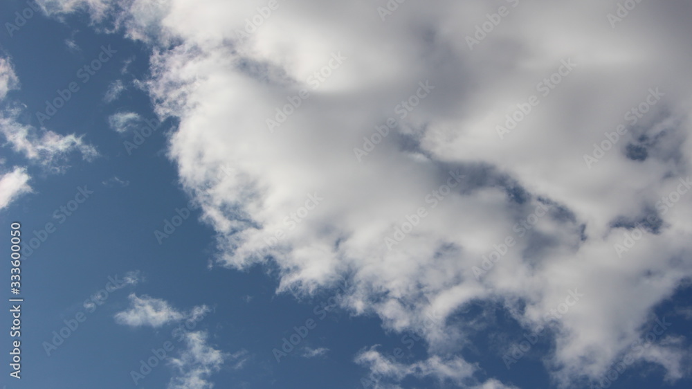 deep blue sky with cumulus white clouds