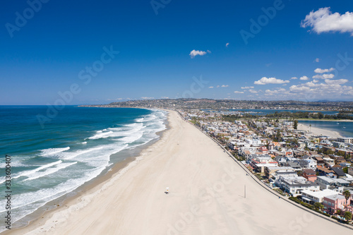 Aerial drone photo of a completely empty Mission Beach due to the Coronavirus and Covid 19 Pandemic. San Diego, Ca, USA. © Spearhead Media
