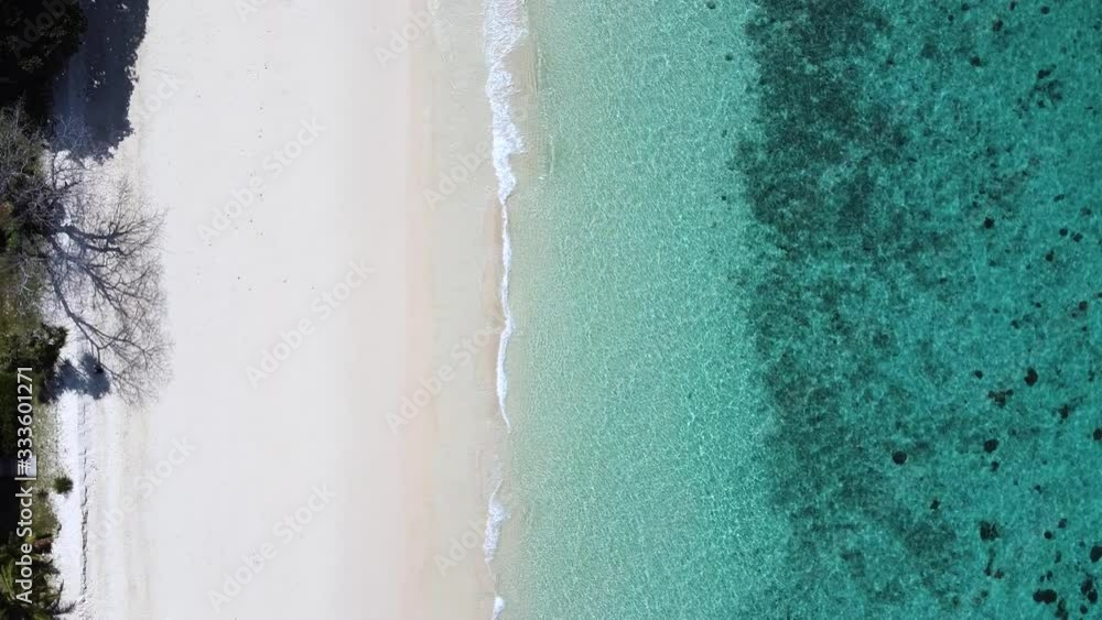amazing and beautiful top view Tropical with beach waves break on white sand beach,Video above turquoise blue sea water on the white sand shore beach Thailand amazing and beautiful top view Tropical with beach waves break on white sand beach,Video above turquoise blue sea water on the white sand shore beach Thailand