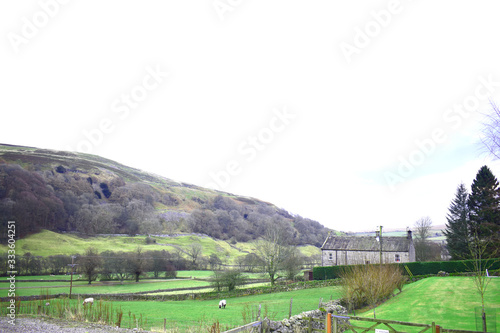 The Yorkshire dales viewed from Arkengarthdale,  surrounding with green fields of farmland photo