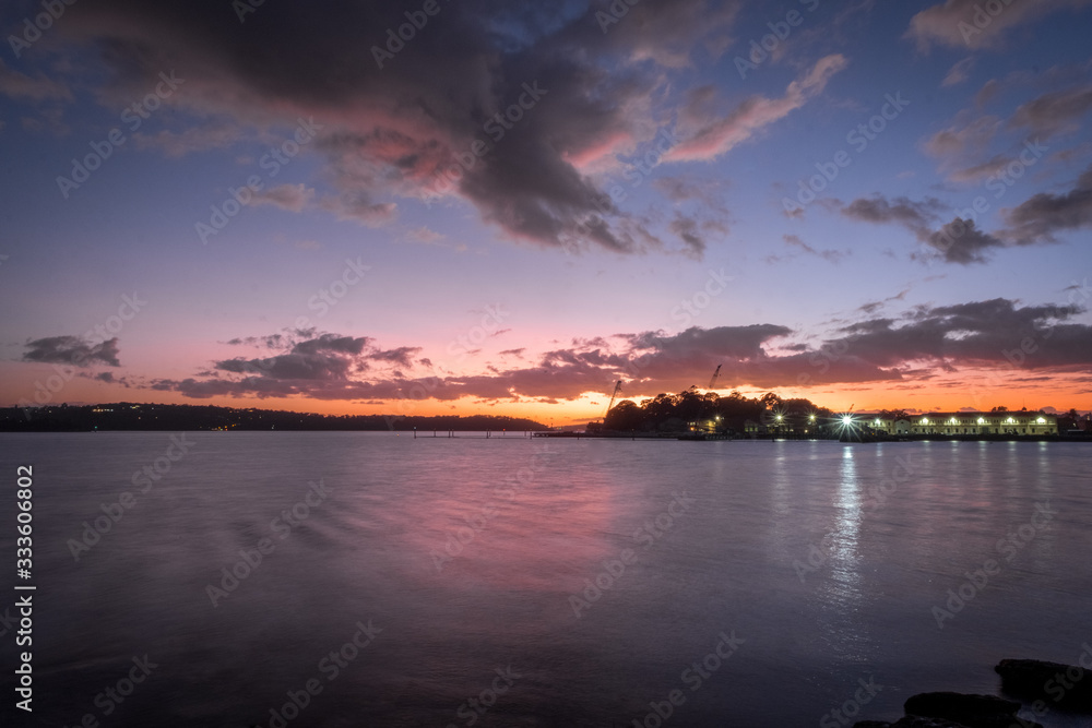 Naklejka premium dawn clouds and harbour workshop lights