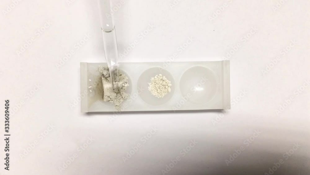 Selective focus on bubble of carbon dioxide from acid drops to