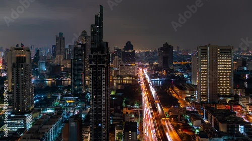 Wallpaper Mural 4K Time lapse High angle aerial view of Metropolis building and city street traffic on highway bridge crossing the river with driving cars on the road and illuminated night lights at downtown district Torontodigital.ca