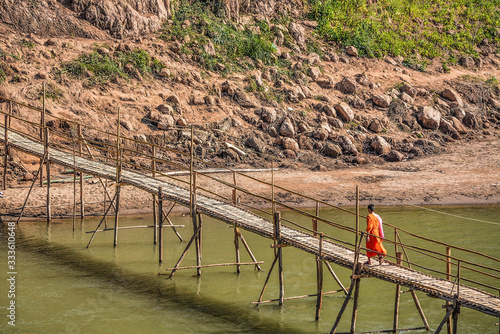 Fototapeta Naklejka Na Ścianę i Meble -   Bamboo bridge over the Kan River, Luang Prabang, Laos