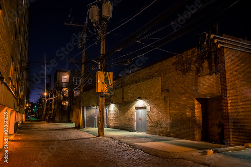 Dark and eerie urban city alley at night