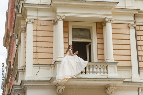 morning of the bride. bride on the balcony in the morning