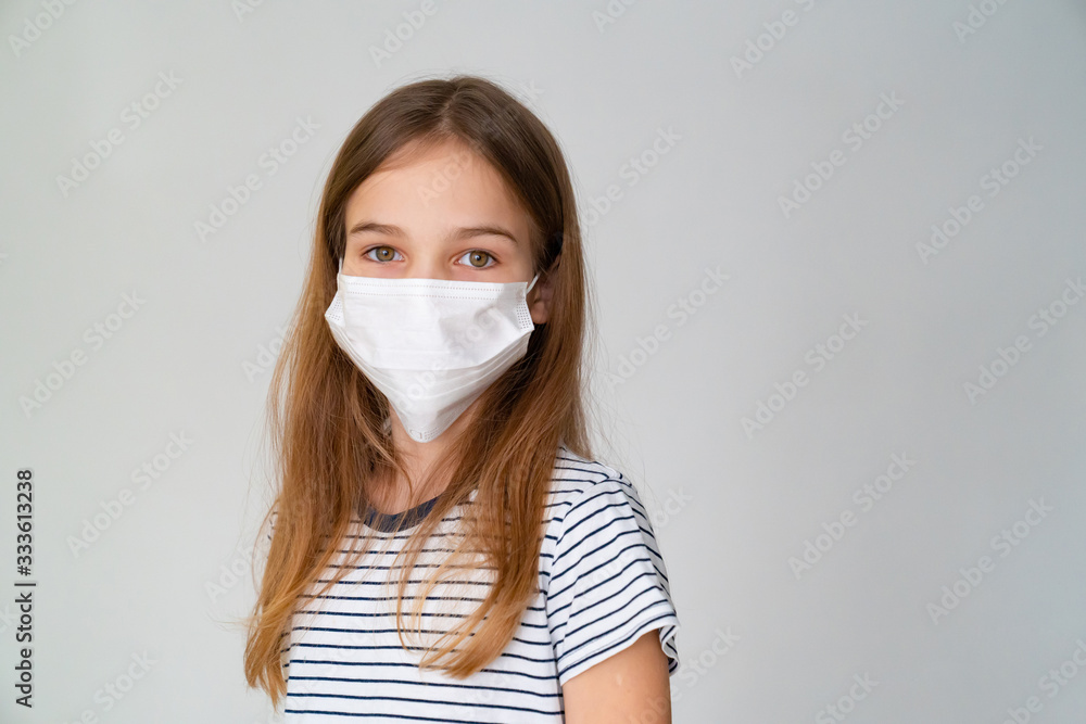 a teenager girl in medical mask white background
