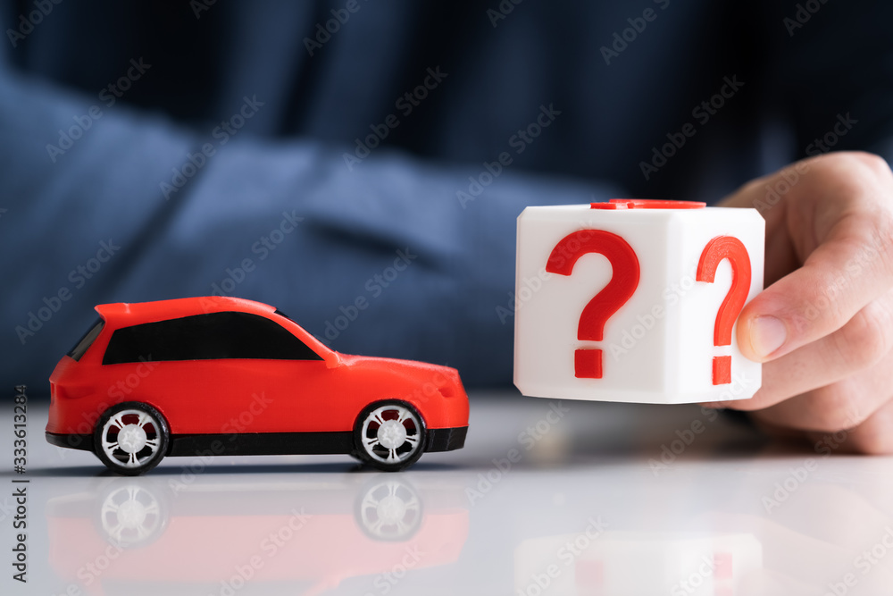Hand Holding Question Mark Next To Car Model Stock Photo Adobe Stock