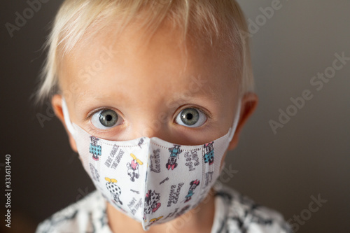 child in medical mask