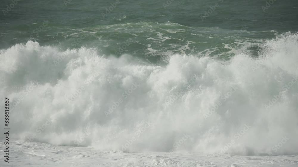 Slow Motion On A Huge Wave Forming On The Rough Seas At Nazare (Nazaré), Portugal. Slow Motion On A Huge Wave Forming On The Rough Seas At Nazare (Nazaré), Portugal.