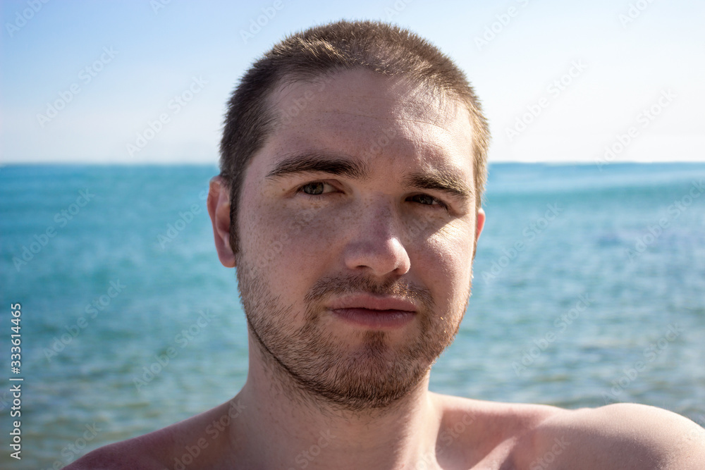 male tourist with a small beard, abroad can not fly home. sea, sun and rest. The virus has blocked all avia transport male tourist with a small beard, abroad can not fly home. sea, sun and rest. The virus has blocked all avia transport