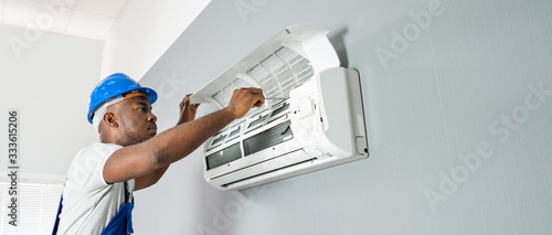 Wallpaper Mural Technician Repairing Air Conditioner Torontodigital.ca