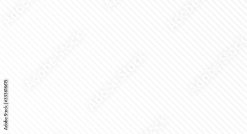 Monochrome geometric pattern of gray diagonal lines on white. Slightly blurred and lighter in bottom left corner. Simple high resolution abstract background.