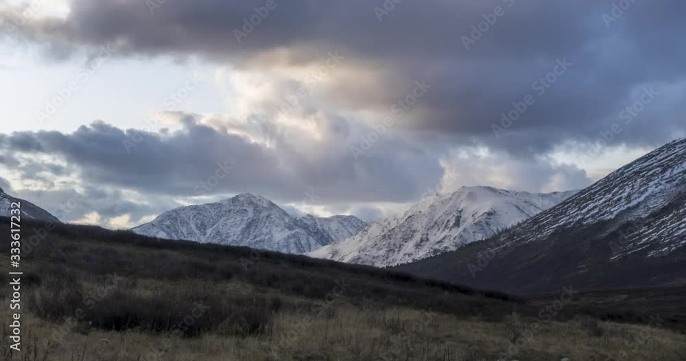 Timelapse of epic clouds at mountain medow at autumn time. Wild endless nature with snow storm sky. Fast movement Timelapse of epic clouds at mountain medow at autumn time. Wild endless nature with snow storm sky. Fast movement