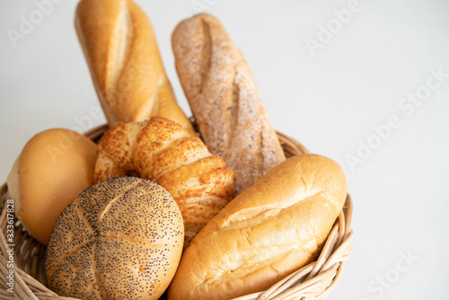 Variety of fresh homemade bread white background