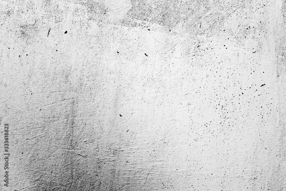 Fototapeta premium Texture of a concrete wall with cracks and scratches which can be used as a background