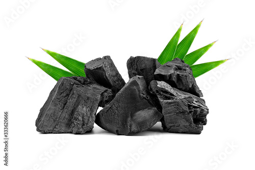 Natural wooden charcoal or traditional hard wood charcoal isolated on white background. photo