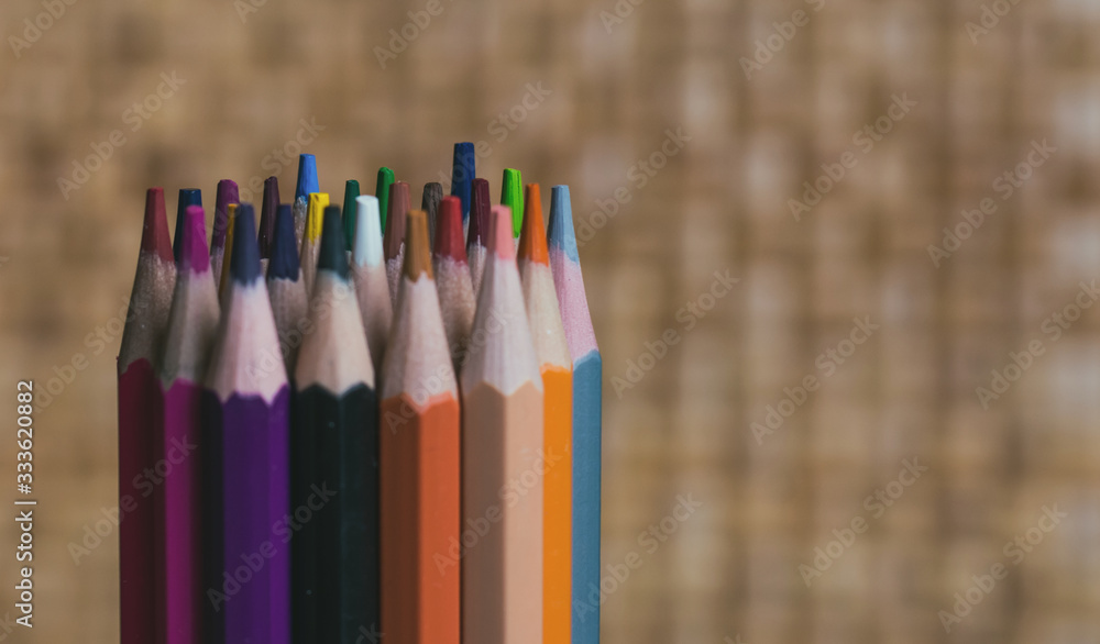 Set of colored pencils, with wooden background Set of colored pencils, with wooden background