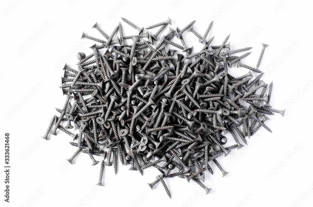 Metal screws on a white background. Tools for fixing and repairing.