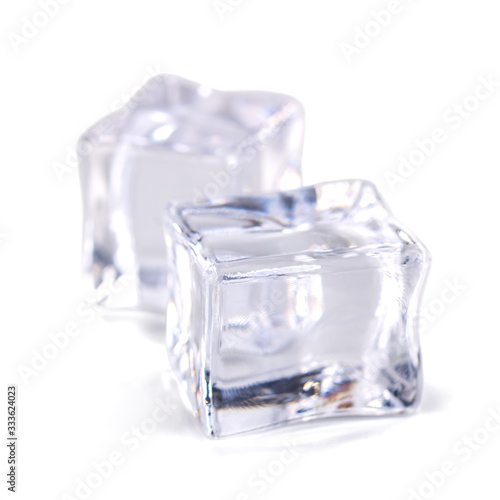 Pile of ice cubes isolated on white background © k_samurkas