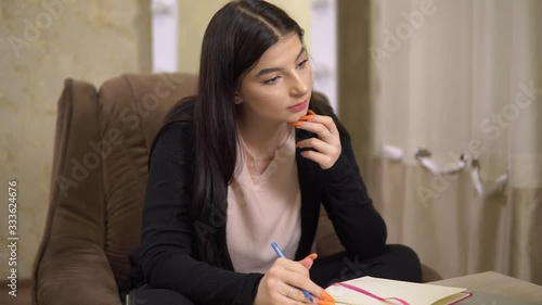 Young woman stydent distance, studying online at home, freelancer, seminar photo