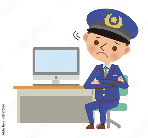 パソコンの前で困った表情をする男性警察官