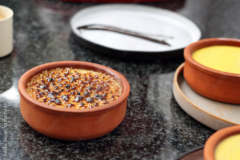 Creme brulee, a sweet French dessert with caramelized sugar crust. Appetizing, sweet dessert with cream, eggs and caramelized sugar crust.