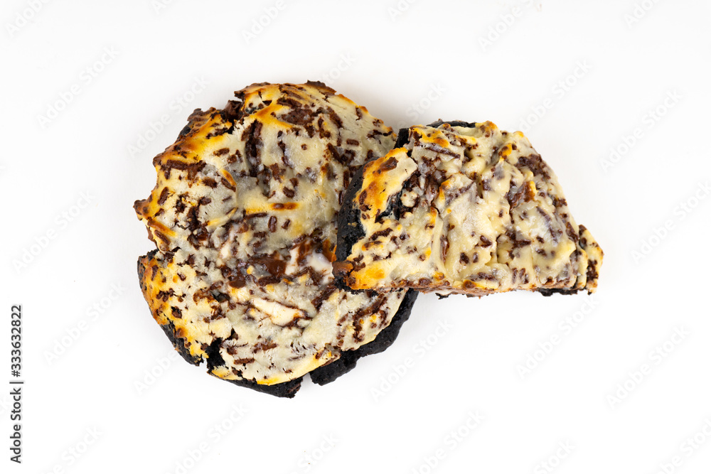 A cookie cake with chocolate on white background with copy space