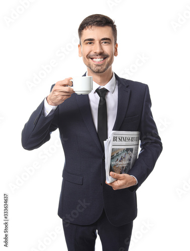 Young businessman with cup ...