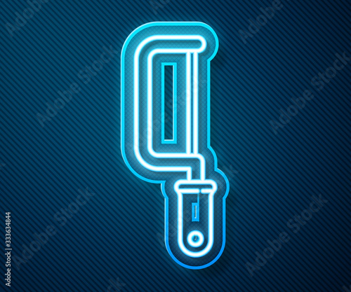 Glowing neon line Hacksaw icon isolated on blue background. Metal saw for wood and metal. Vector Illustration