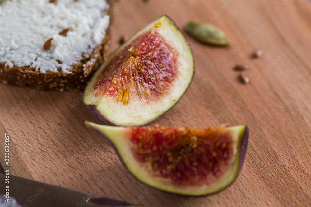 sliced figs and cheese sandwich on a cutting board sliced figs and cheese sandwich on a cutting board