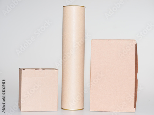 Fototapeta Cardboard boxes and tube brown on white grey background