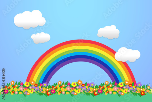 Rainbow and clouds in the blue sky, and flowers