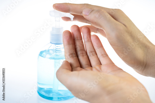 Man washing hands with sanitizer gel bottle or soap for coronavirus prevention  hygiene to stop spreading covid-19  select focus 