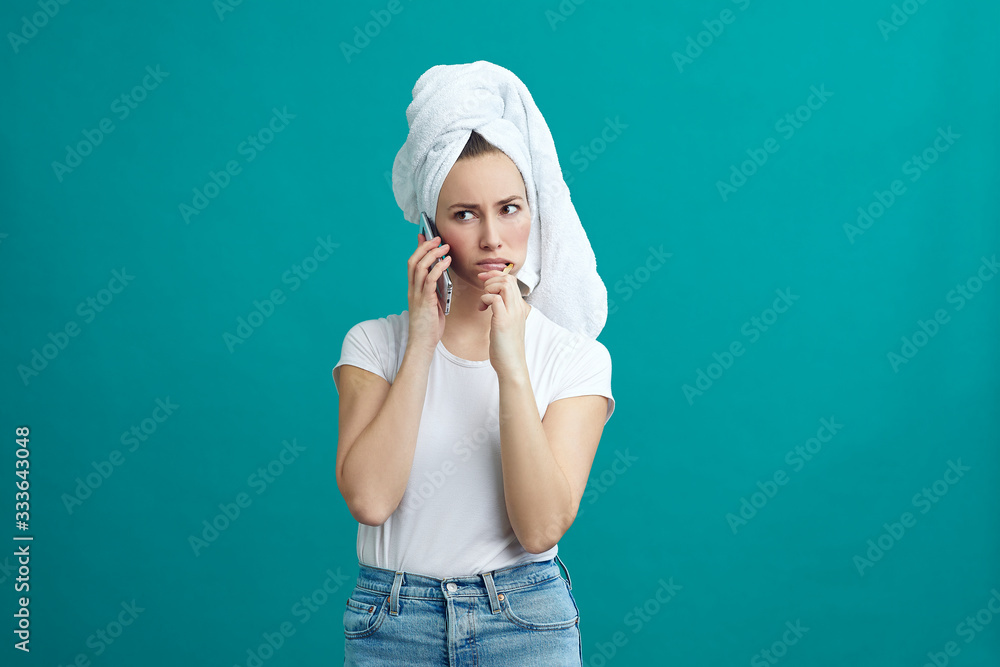 Busy woman talking on the phone while brushing her teeth on a nice colorful background Busy woman talking on the phone while brushing her teeth on a nice colorful background
