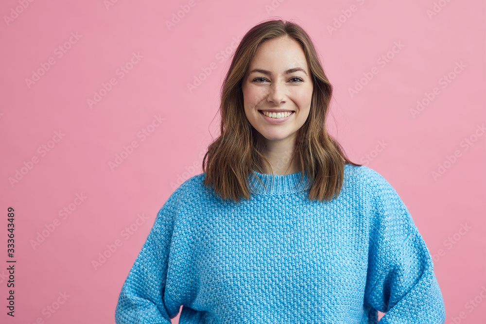 Portrait for beautiful smiling woman on a pink background, colorful portrait - obrazy, fototapety, plakaty 