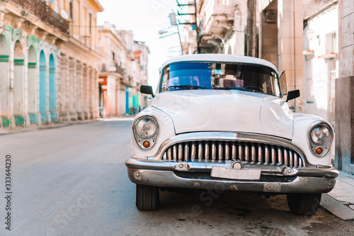 View of yellow classic vintage car in Old Havana, Cuba © travnikovstudio