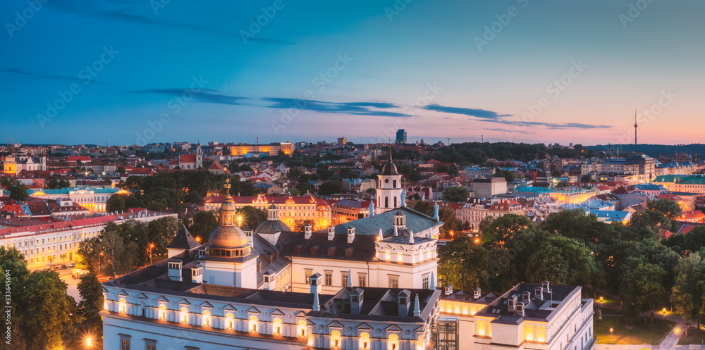 Fototapeta premium Vilnius, Lithuania, Eastern Europe. Night Panoramic View Of Historic Center Cityscape In Blue Hour. Travel View Of Old Town In Night Illuminations. UNESCO. Palace Of The Grand Dukes Of Lithuania.