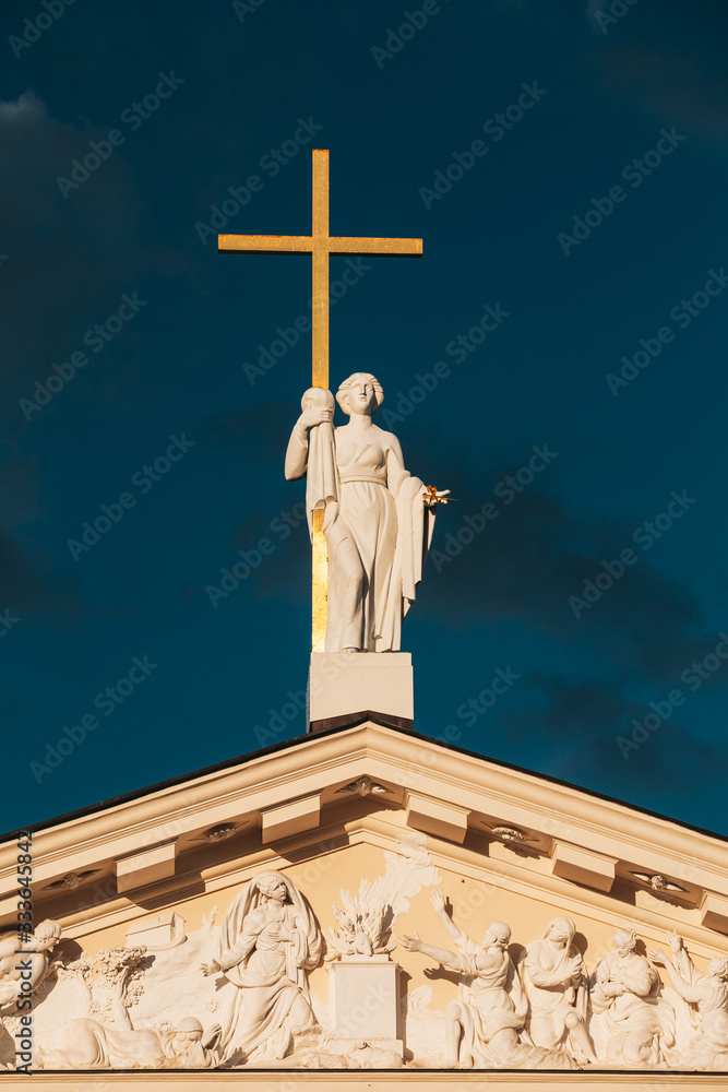 Vilnius, Lithuania. Close View Of Statue Of St. Helena With Cross On Roof Of Cathedral Basilica Of St Stanislaus And St Ladislaus Vilnius, Lithuania. Close View Of Statue Of St. Helena With Cross On Roof Of Cathedral Basilica Of St Stanislaus And St Ladislaus