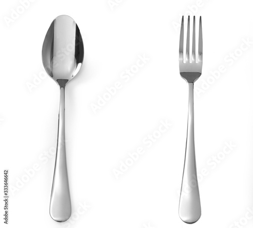 Fork and spoon stainless steel isolated on white background. Top view on cutlery photo